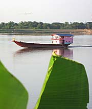 A Houseboat / Freighter on the Mekong at Nong Khai by Asienreisender